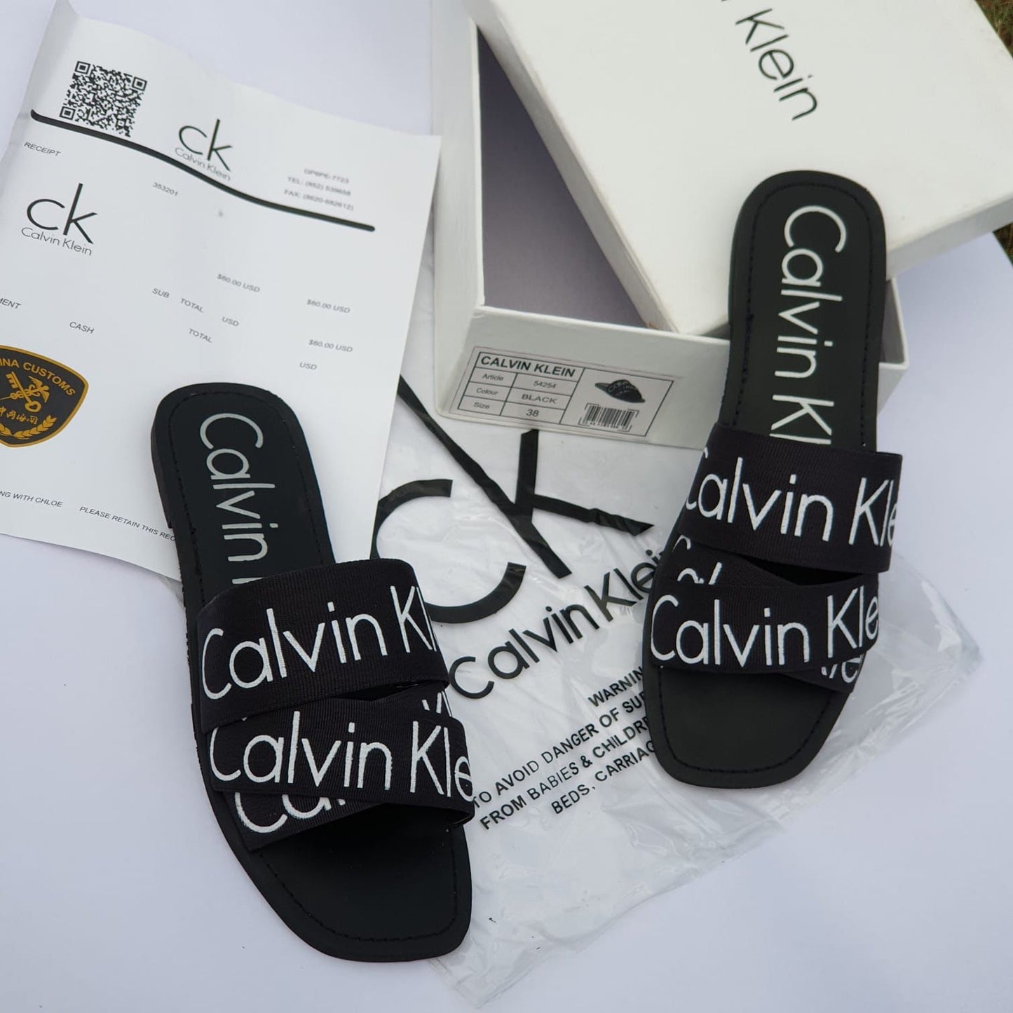 Calvin Klein Flat Slippers – Comfortable Women’s Footwear with Brand Box (Black/White)