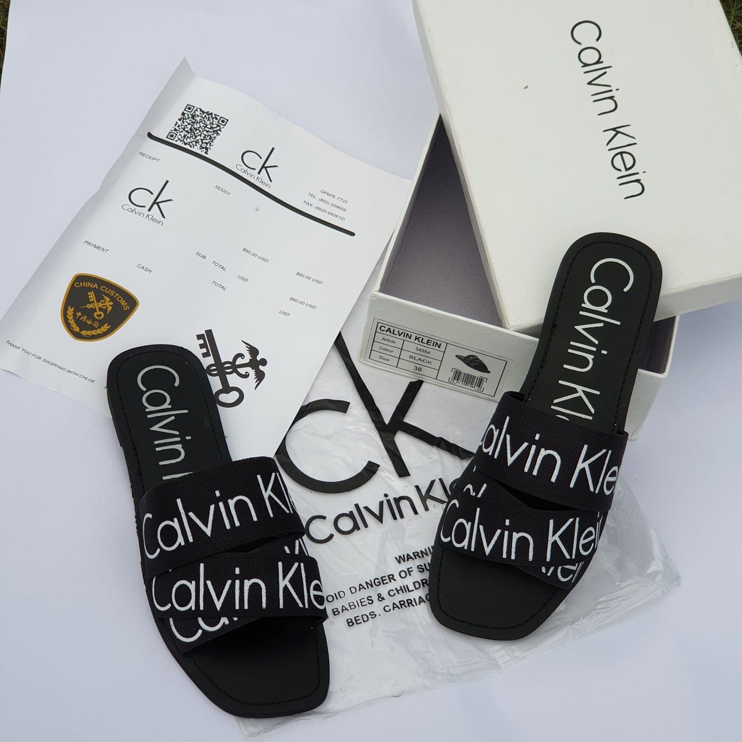 Calvin Klein Flat Slippers – Comfortable Women’s Footwear with Brand Box (Black/White)