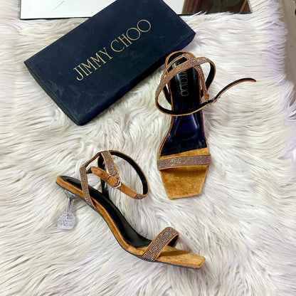 Jimmy Choo Transparent Heel – Elegant & Modern (Golden)