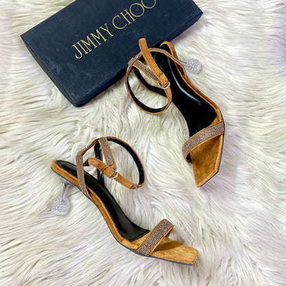 Jimmy Choo Transparent Heel – Elegant & Modern (Golden)
