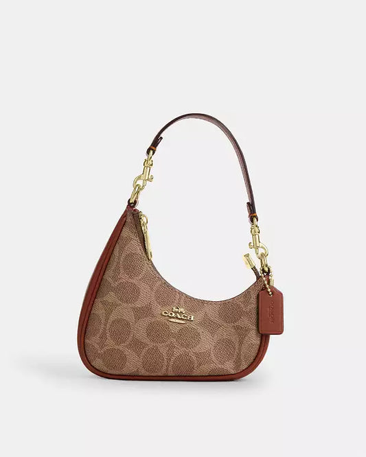 C-O-A-C-H Twisted Teri Shoulder Women Bag – Signature Canvas Edition (Brown-2)