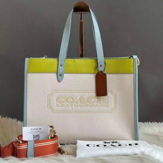 C-O-A-C-H FIELD TOTE 30 COLORBLOCK WITH BADGE – Women Bag (White with Yellow)